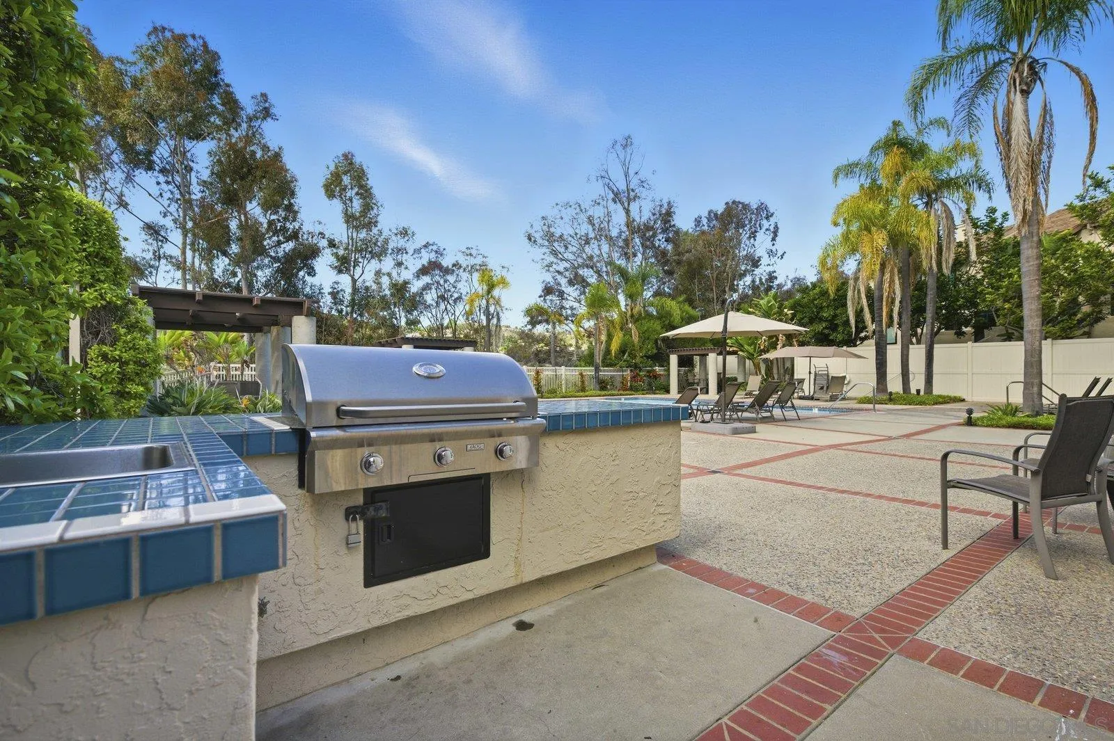 2742 Ariane Drive, Unit 153 San Diego, CA 92117 - Photo 33 of 43 a view of a patio with swimming pool