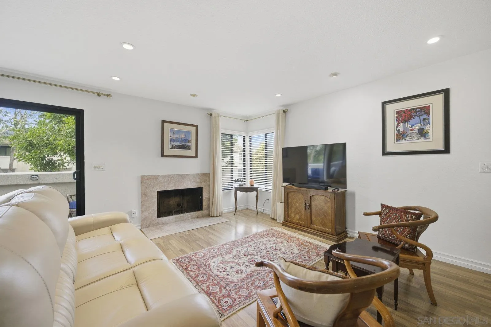 2742 Ariane Drive, Unit 153 San Diego, CA 92117 - Photo 9 of 43 a living room with furniture and a flat screen tv