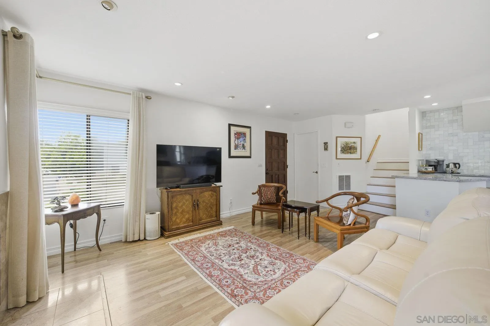 2742 Ariane Drive, Unit 153 San Diego, CA 92117 - Photo 10 of 43 a living room with furniture and a flat screen tv