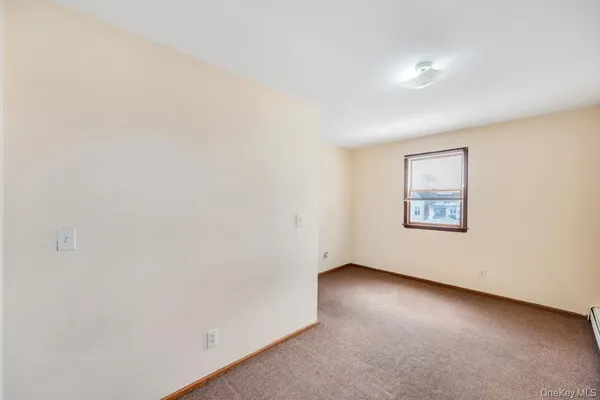 an empty room with a bench