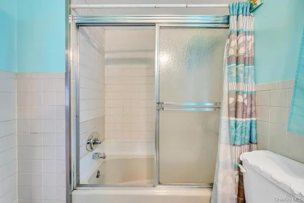 a bathroom with a shower and a tub