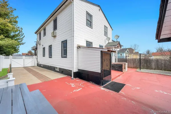 a view of a house with wooden floor and fence