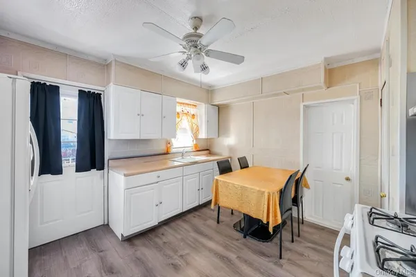 a room with two chairs and a chandelier