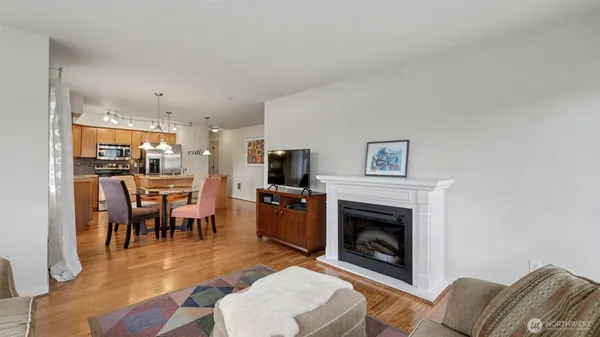 a living room with furniture a fireplace and a table