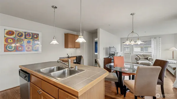 a dining room with furniture a chandelier and window