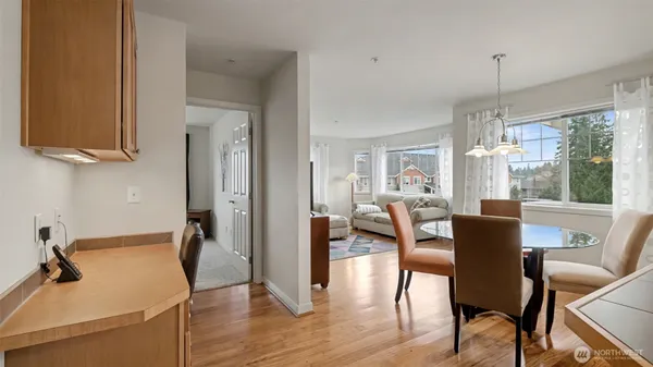 a view of a dining room with furniture window and wooden floor