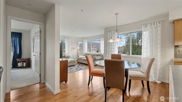 a dining room with furniture window wooden floor