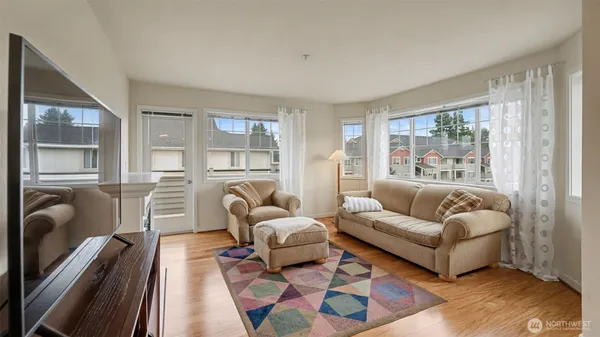 a living room with furniture and a large window