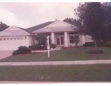8093 Southwest Yachtsmans Drive Stuart, FL 34997 - Photo 1 of 1 a front view of a house with garden