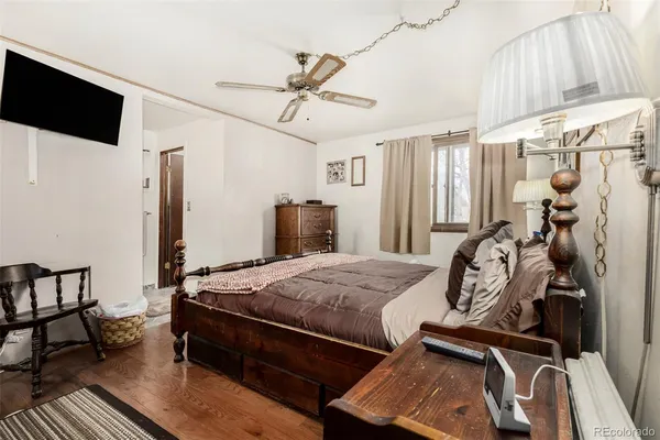 a bedroom with bed and a window