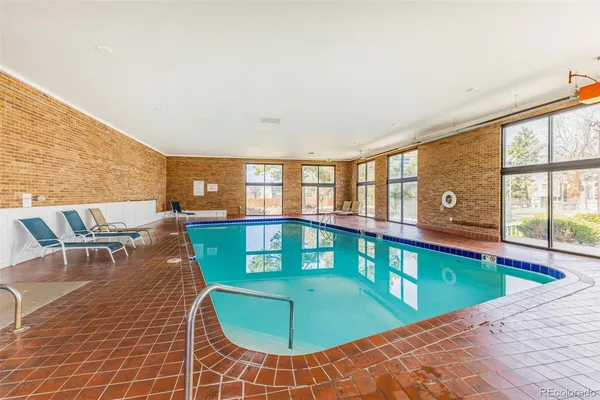 a view of a swimming pool with a lounge chair