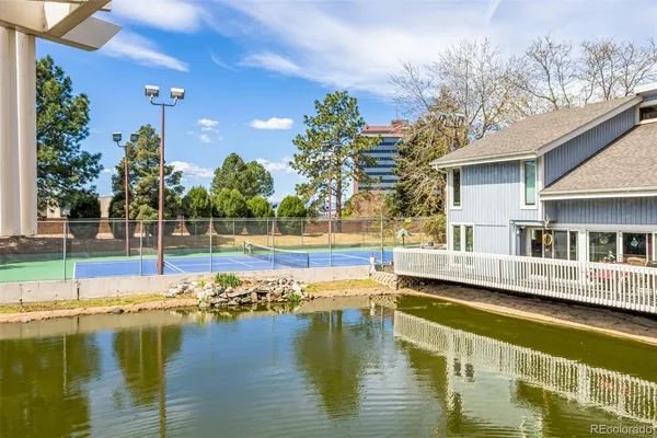 a view of a swimming pool with a lawn chairs