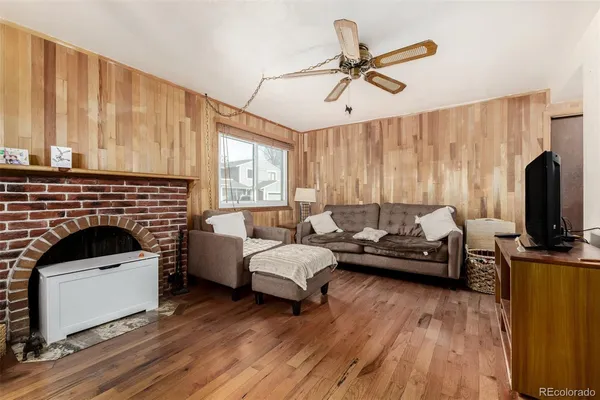 a living room with furniture fireplace and flat screen tv