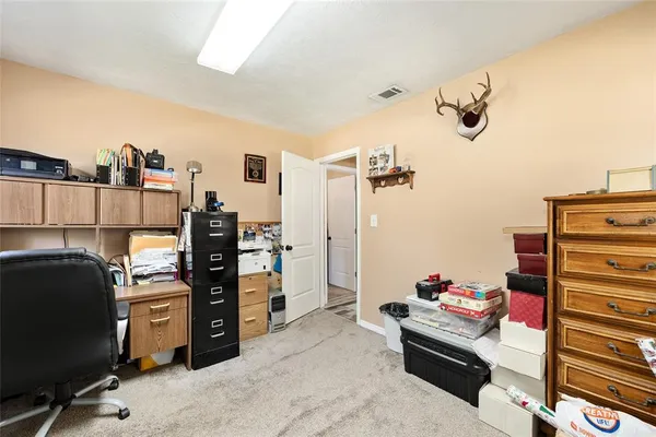 a dining room with table chairs and a chandelier