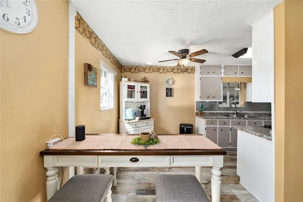 a kitchen with a sink stove and refrigerator