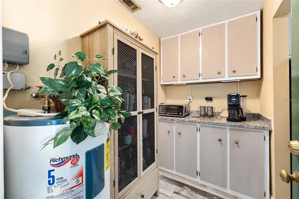 a living room with furniture large window and flat screen tv