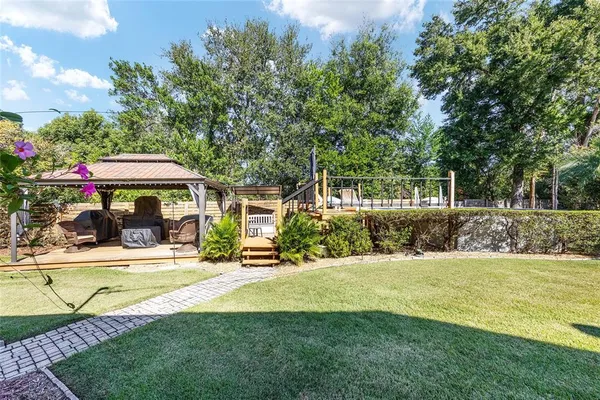 a view of a swimming pool with a patio