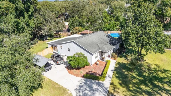 an aerial view of a house with swimming pool