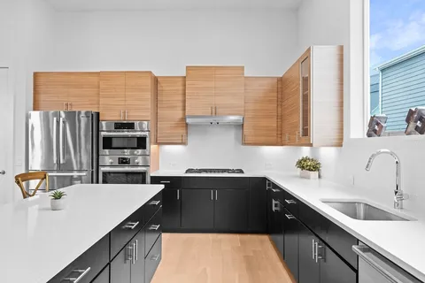 a kitchen with a sink and a refrigerator