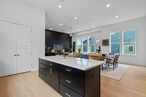 a kitchen with a sink a counter top space and stainless steel appliances