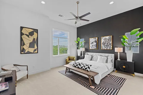 a bedroom with a bed and a couch