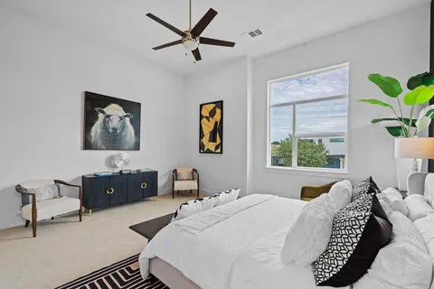 a bedroom with a bed and a couch