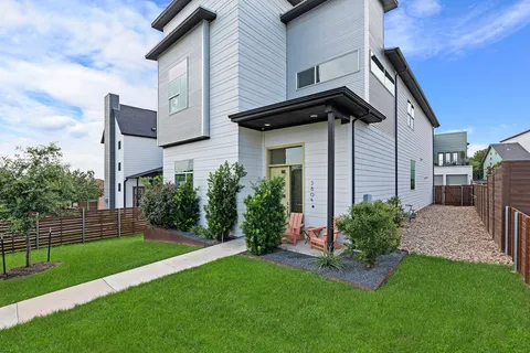 a front view of house and yard with green space