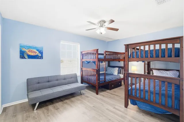 a bedroom with furniture and a book shelf