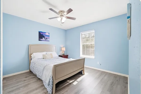 a bed room with a bed and a chandelier