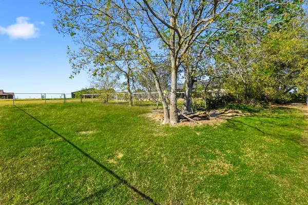 a view of backyard with green space