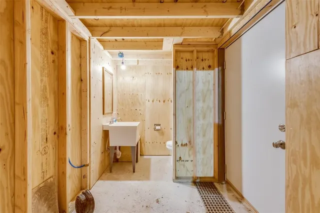 a bathroom with a glass shower door