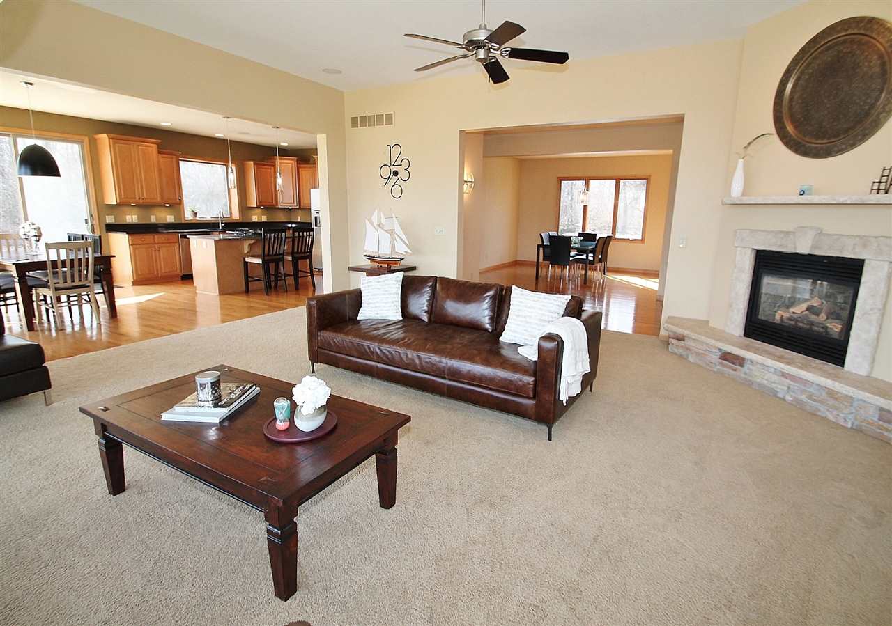 575 Spring Creek Road Rockford, IL 61114 - Photo 6 of 25 a living room with furniture and a fireplace