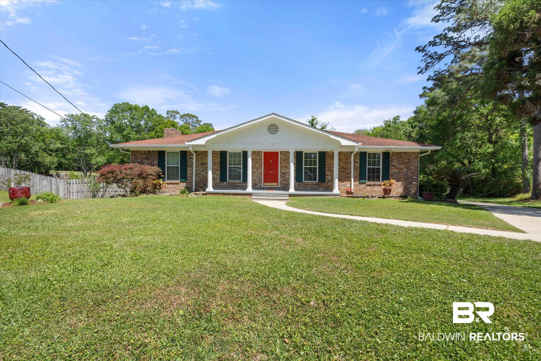 706 Sutherland Drive Chickasaw, AL 36611 - Photo 1 of 33 Single story home featuring a chimney, fence, a porch, a front yard, and brick siding