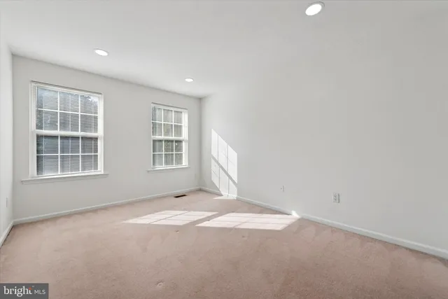a view of empty room with windows