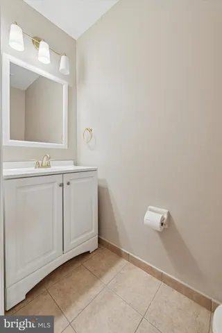 a bathroom with a sink a vanity and mirror