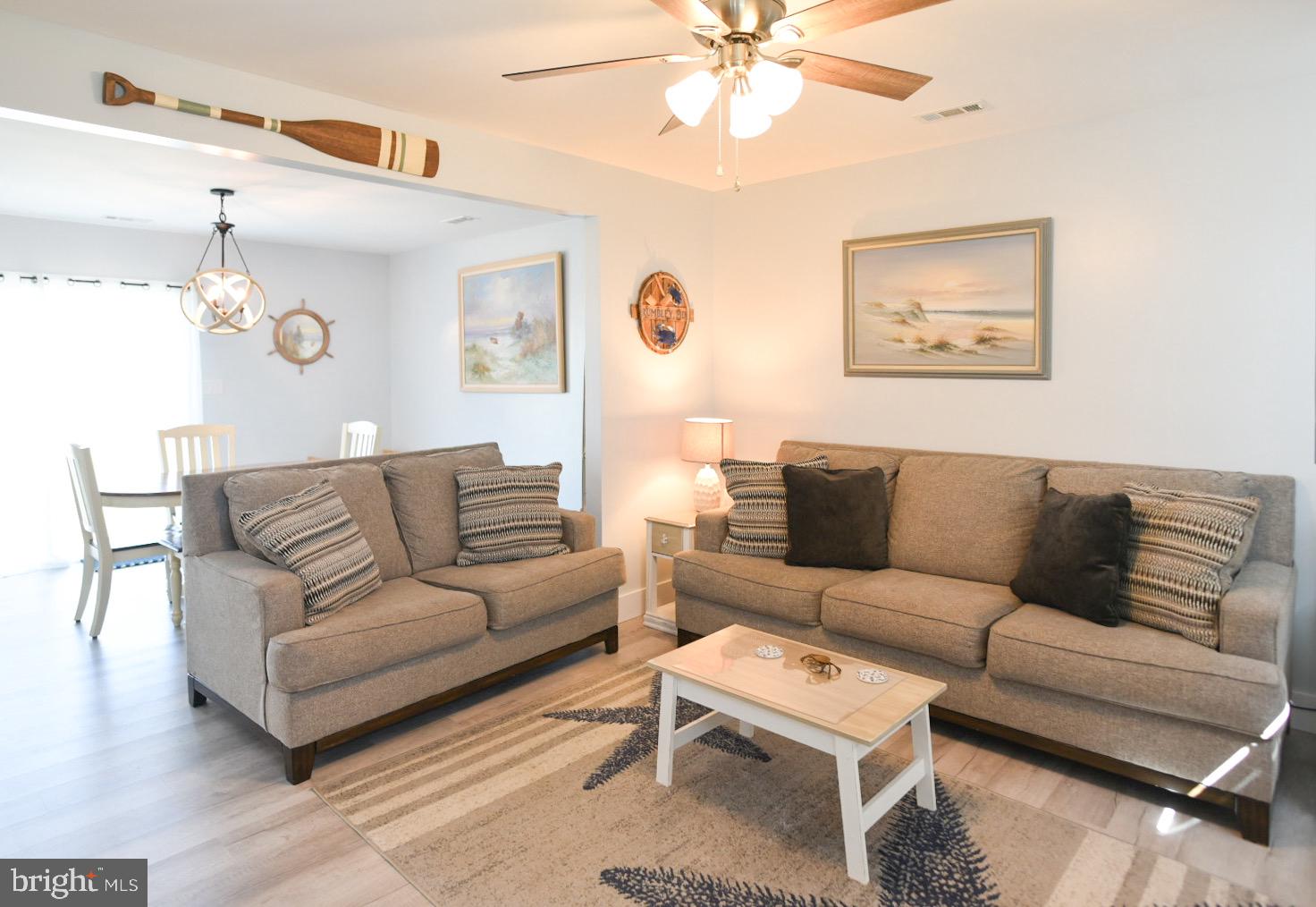 25830 Rumbley Road Westover, MD 21871 - Photo 11 of 59 a living room with furniture and a chandelier