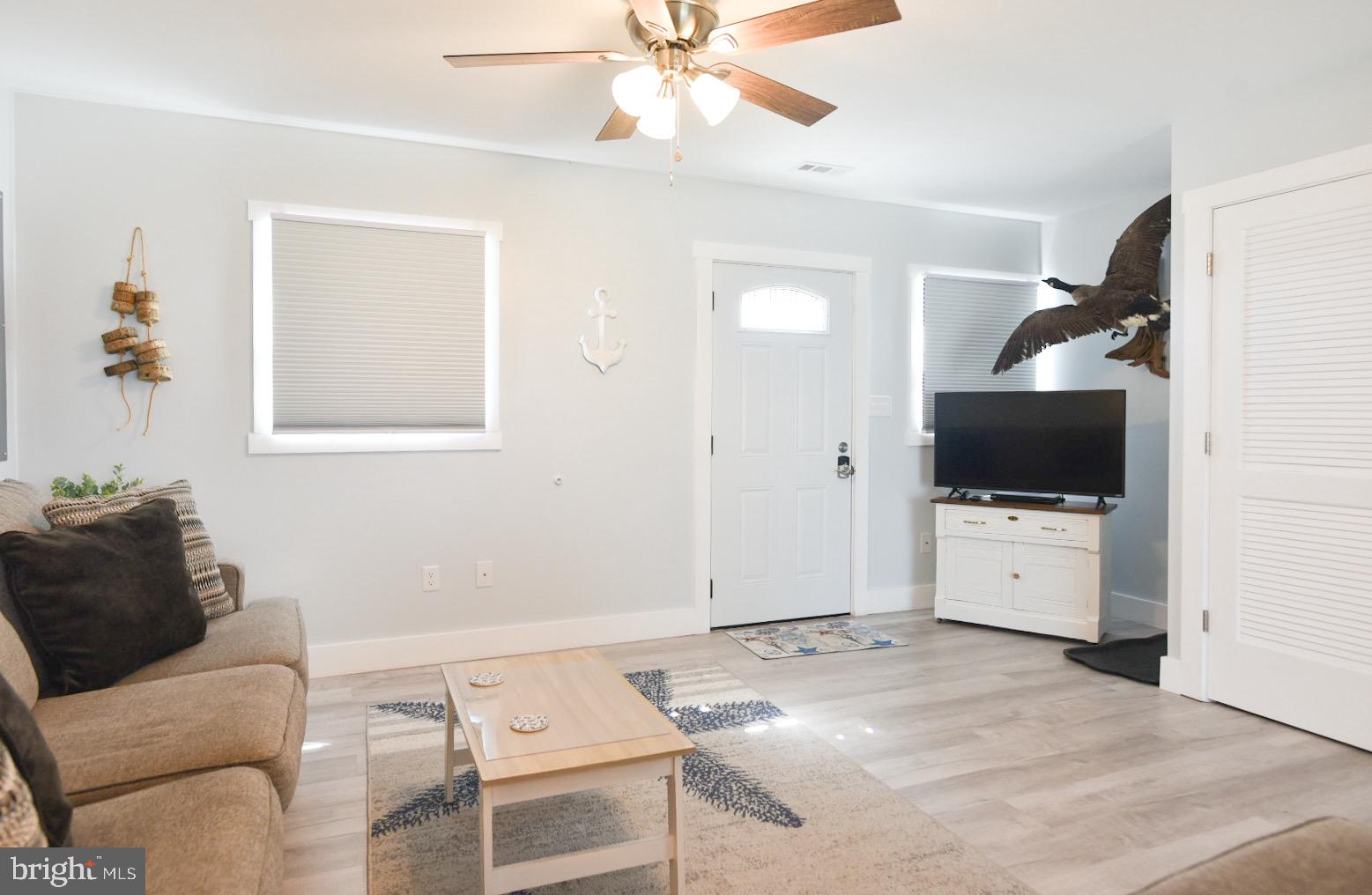 25830 Rumbley Road Westover, MD 21871 - Photo 14 of 59 a living room with furniture and a flat screen tv