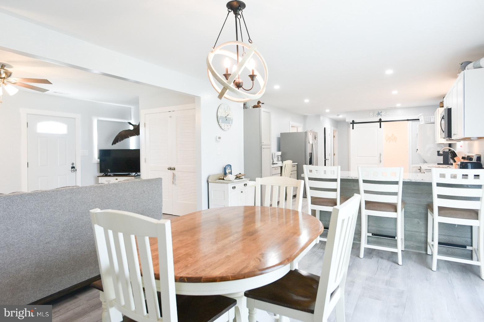 25830 Rumbley Road Westover, MD 21871 - Photo 16 of 59 a view of a dining room with furniture and wooden floor