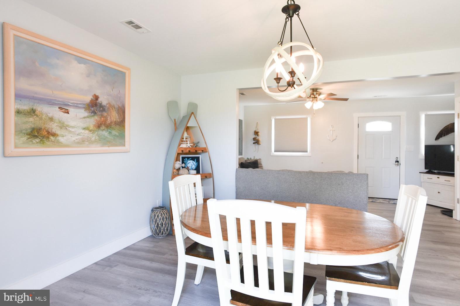 25830 Rumbley Road Westover, MD 21871 - Photo 17 of 59 a view of a dining room with furniture and wooden floor