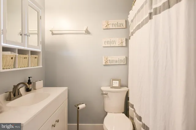 a bedroom with a bed and a cabinets