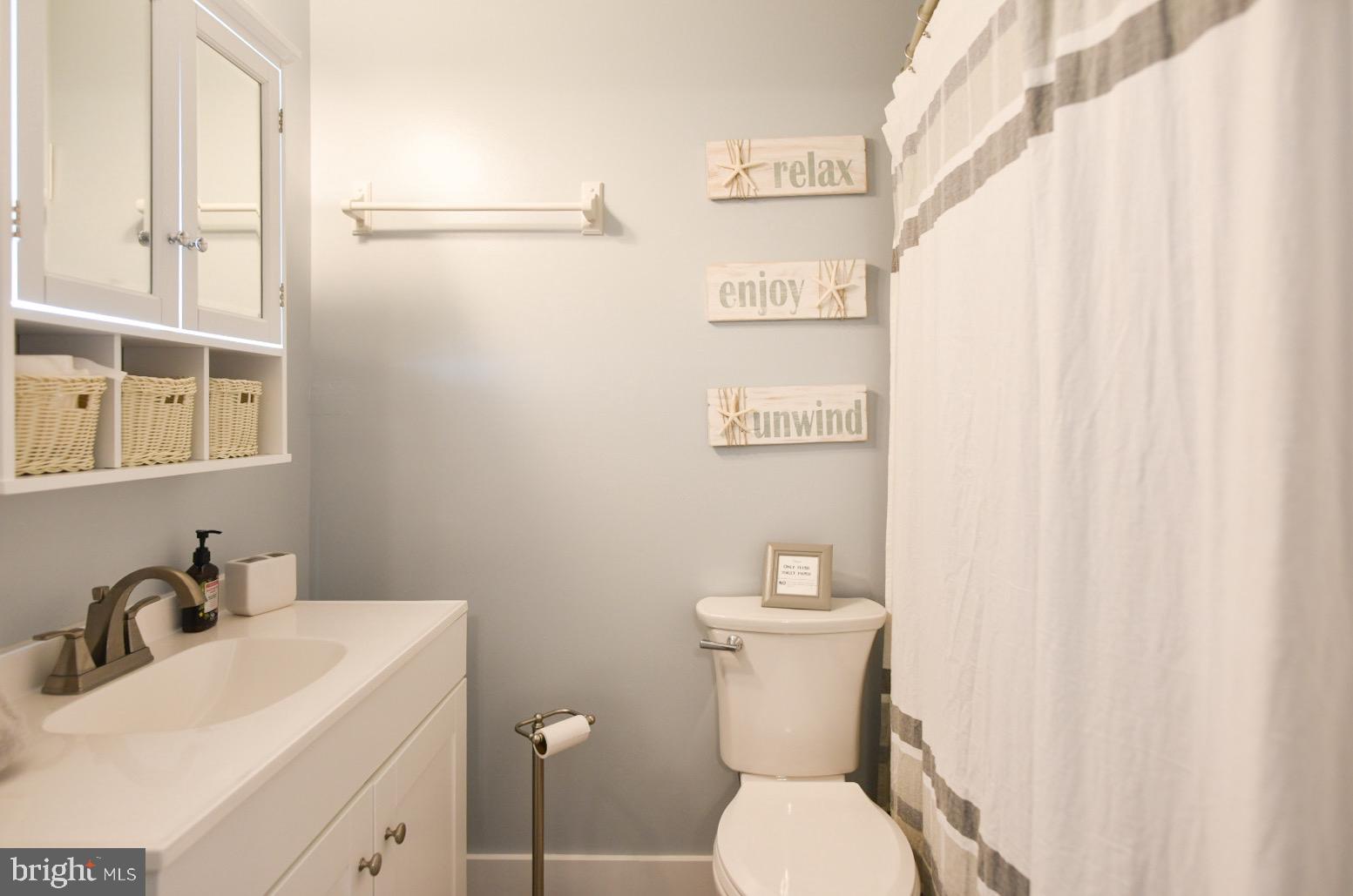 25830 Rumbley Road Westover, MD 21871 - Photo 28 of 59 a white toilet sitting next to a bathroom sink