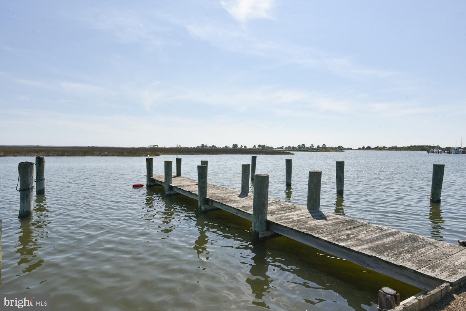 25830 Rumbley Road Westover, MD 21871 - Photo 3 of 59 a view of a lake with a bench