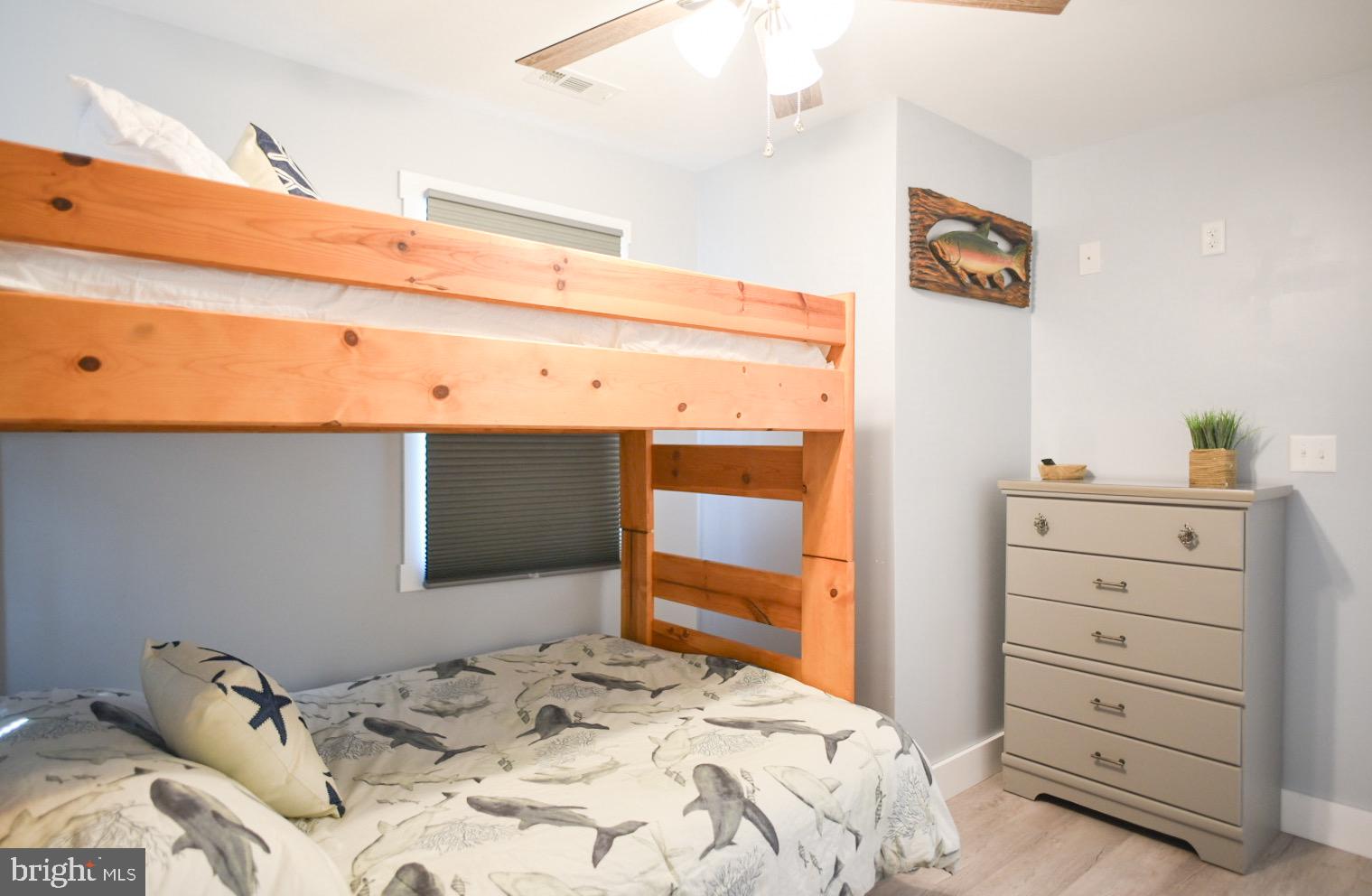 25830 Rumbley Road Westover, MD 21871 - Photo 31 of 59 a bedroom with a bed and a cabinets