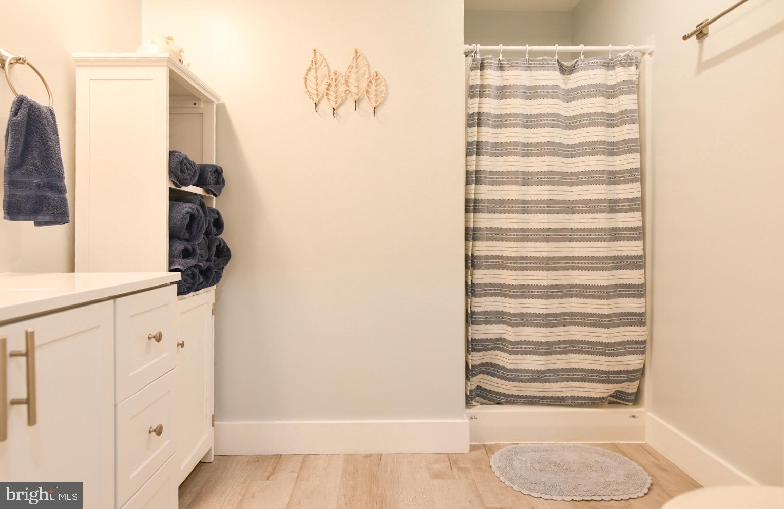 25830 Rumbley Road Westover, MD 21871 - Photo 34 of 59 a bathroom with a sink and a mirror