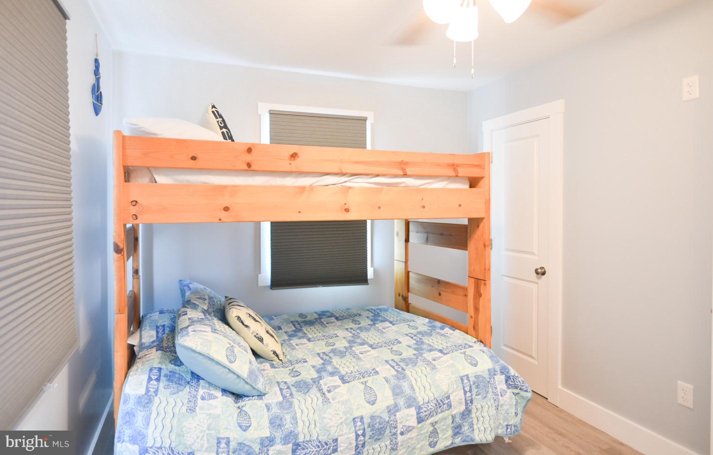 25830 Rumbley Road Westover, MD 21871 - Photo 36 of 59 a bedroom with a bed and a mirror