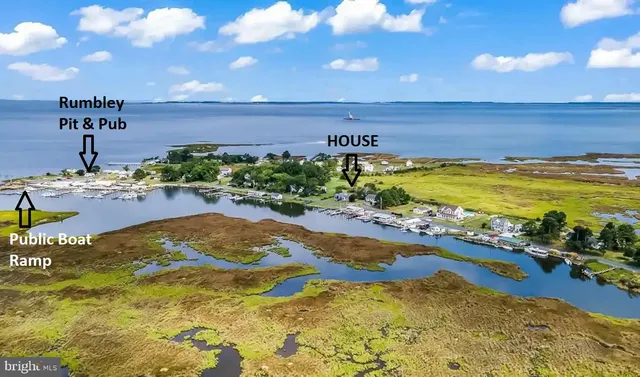 a view of backyard with slide and swing