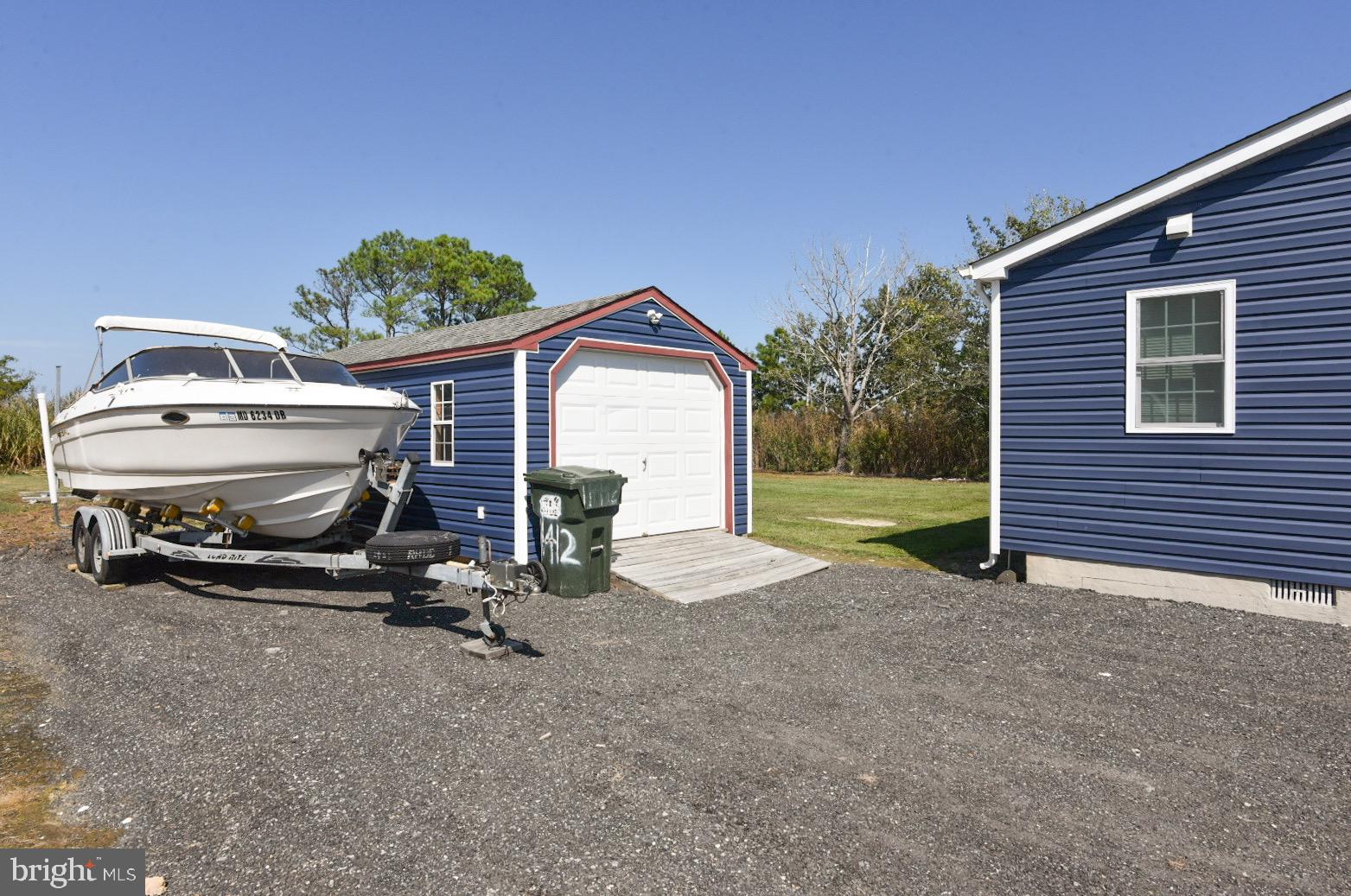 25830 Rumbley Road Westover, MD 21871 - Photo 9 of 59 a view of backyard with slide and swing