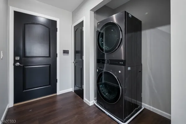 a view of a storage and utility room with washer and dryer