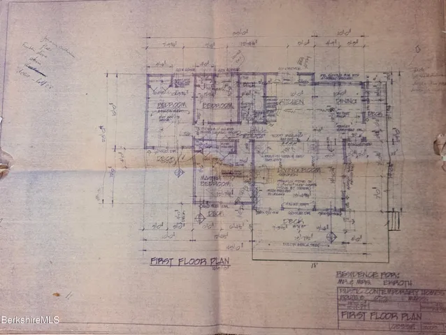a view of a chairs and table in backyard