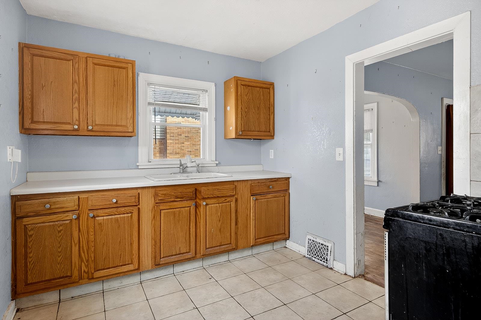 2823 Ridgeway Avenue Rockford, IL 61101 - Photo 12 of 28 a kitchen with stainless steel appliances granite countertop a sink stove and cabinets